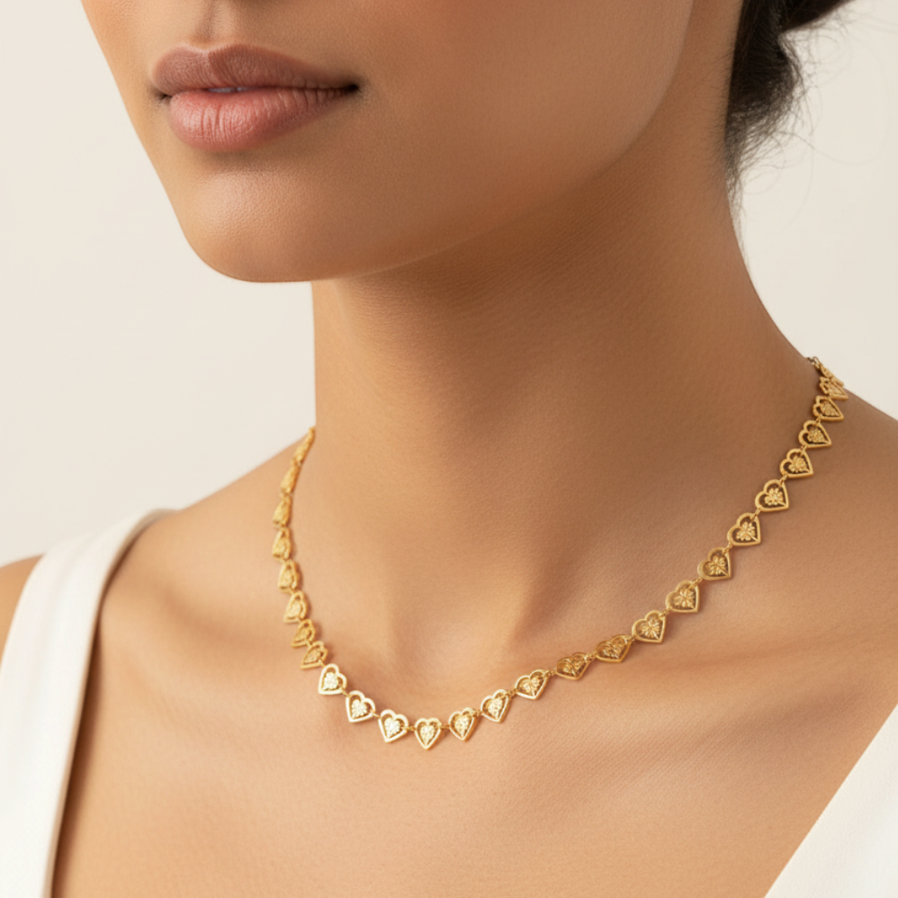 Gold linked hearts chain necklace worn — model shot