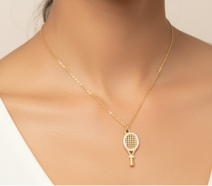 Gold Necklace with Crystal Tennis Racket Pendant worn — model shot