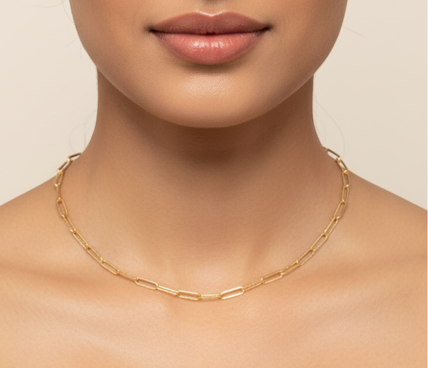 Gold paperclip chain necklace worn — model shot