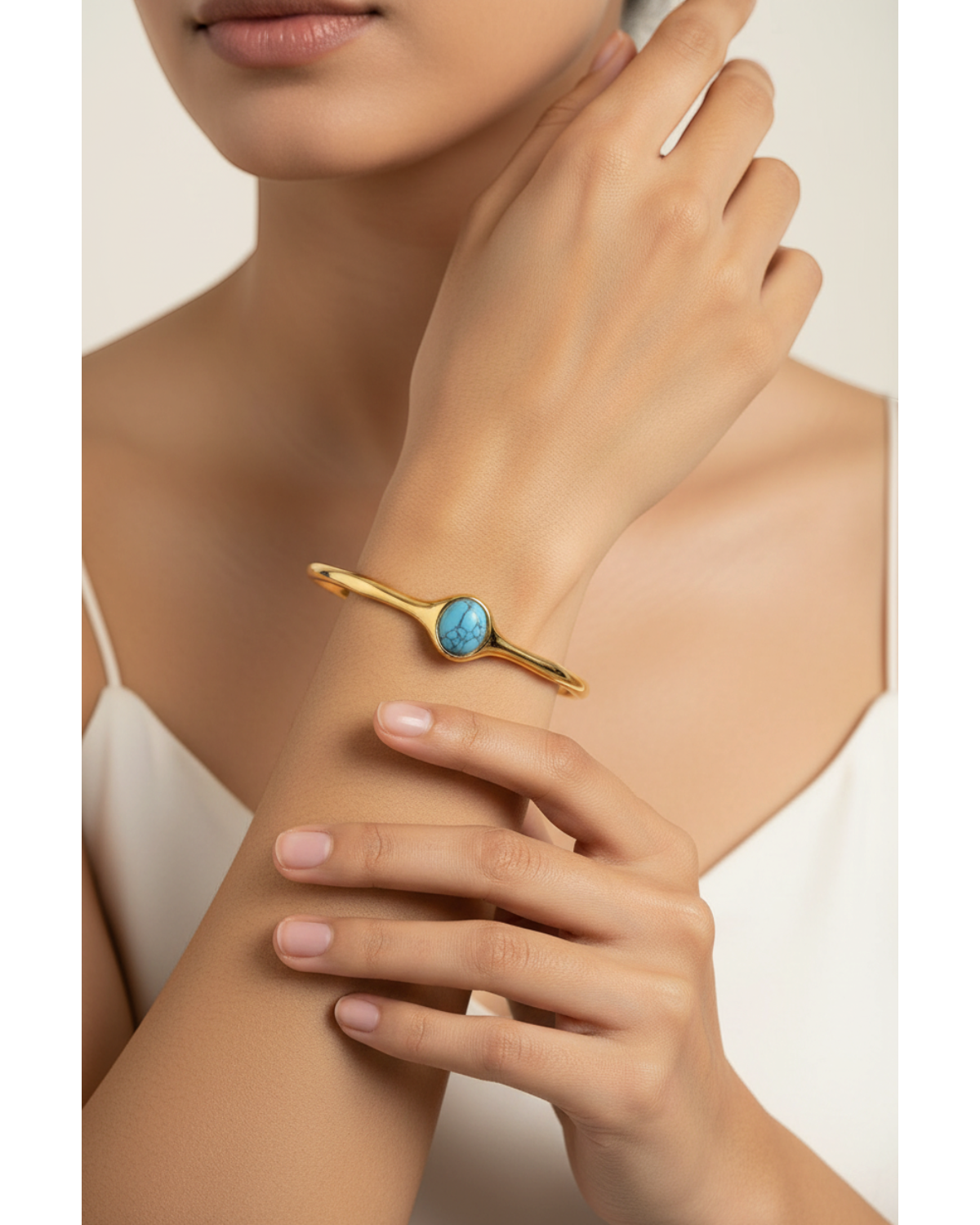 Gold bangle with turquoise stone worn — model shot