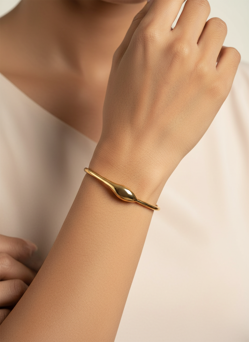 Droplet Signet Bangle worn on wrist — Kriaza