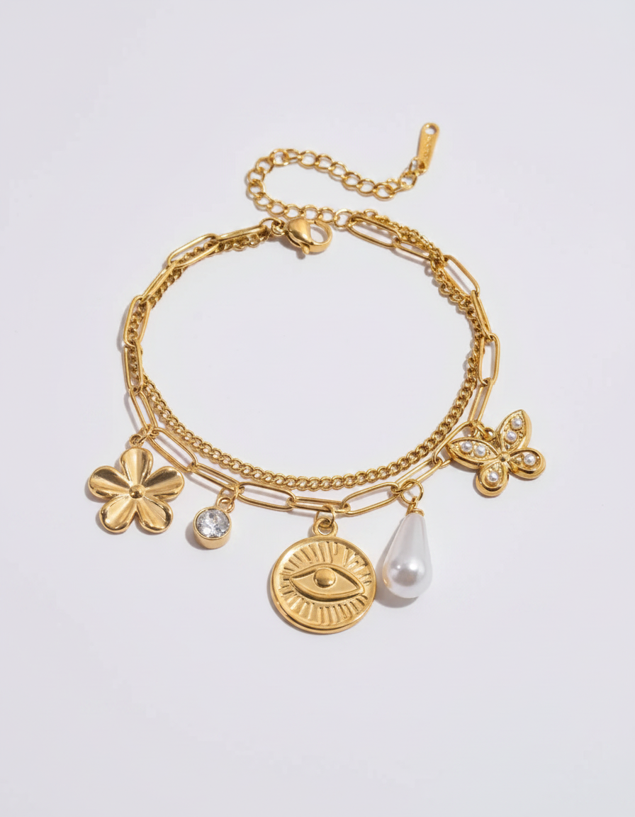 Talisman Charm Layered Bracelet — gold charm bracelet with evil-eye coin