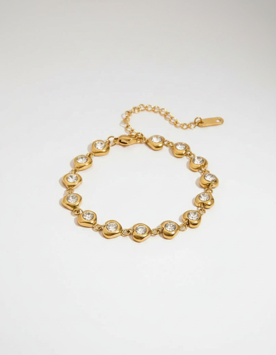 Crystal Heart Link Bracelet — gold heart links with bezel-set crystals