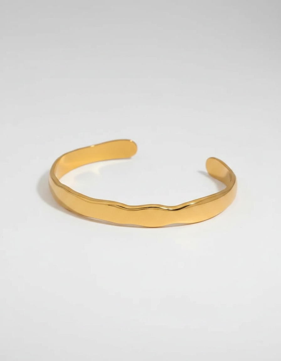 Tidal Wave Cuff — polished gold open cuff with organic wave profile