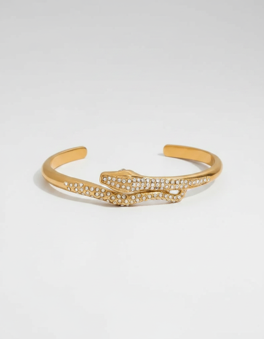 Pave Serpent Wrap Cuff — gold serpent cuff covered in pave crystals